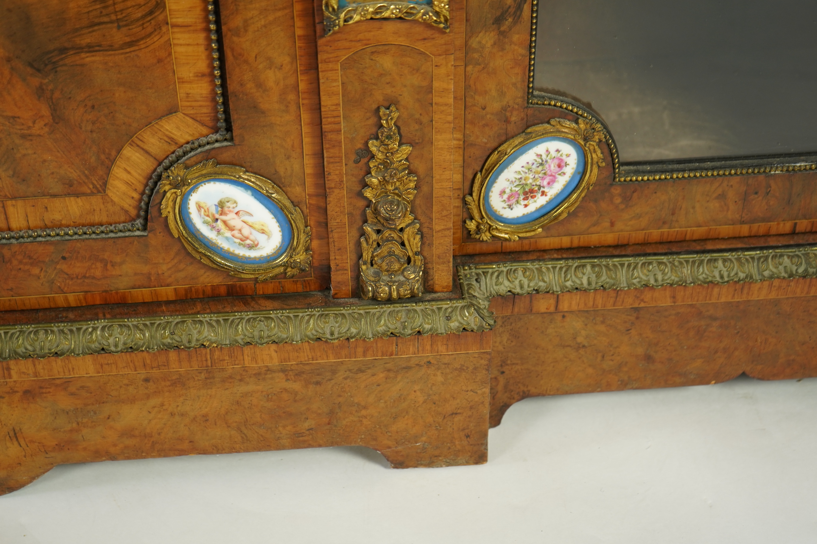 A Victorian tulip banded and gilt metal mounted walnut breakfront side cabinet